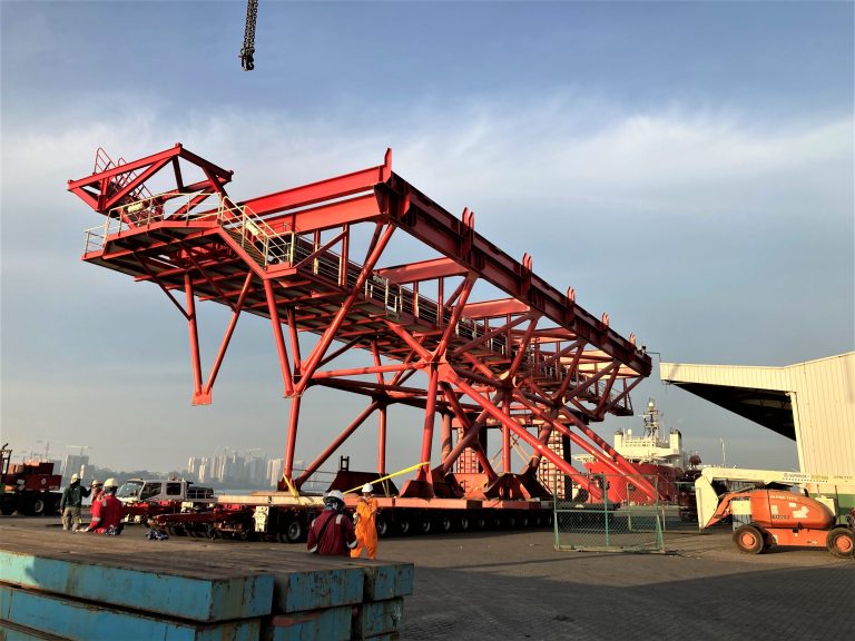 A professional structural integrity marine survey on a large red offshore frame.