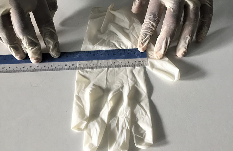 Cargo surveyor conducting close inspection of cargo surface and condition