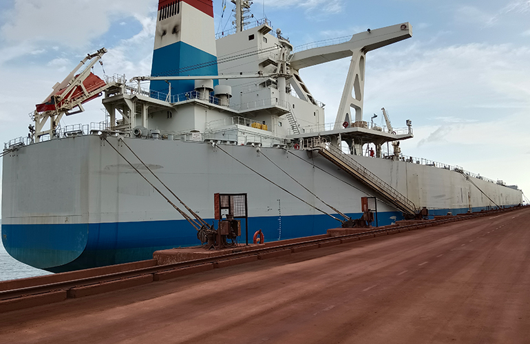 Marine inspector conducting vessel survey inspection on ship deck area