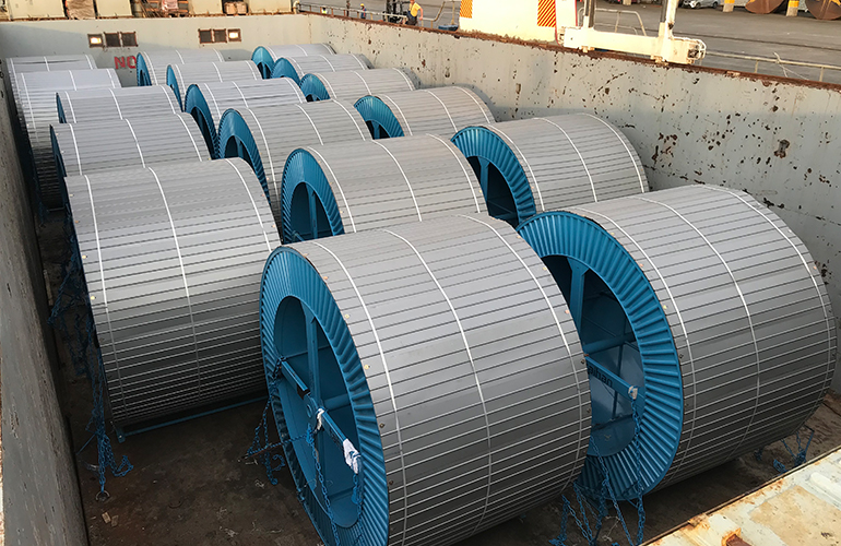 Specialized inspection of large steel coils as part of a breakbulk cargo survey.