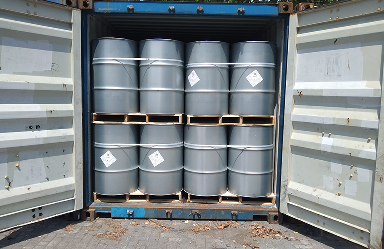 Internal view of an open shipping unit showing organized container cargo barrels.