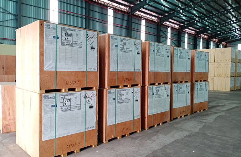 Industrial wooden crates palletized and ready for loading as container cargo.